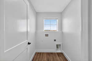 Laundry area with washer hookup, dark wood-type flooring, and hookup for an electric dryer