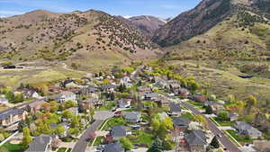 Aerial perspective of suburban area with a mountain backdrop