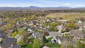 Aerial view of residential area featuring a mountain backdrop