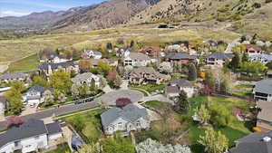 Aerial view of residential area featuring mountains