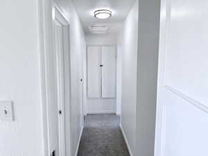 Hallway with carpet and cooling unit