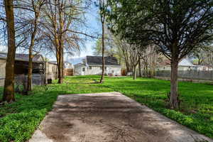 Fenced yard with a residential view