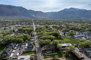 Aerial perspective of suburban area featuring a mountain backdrop