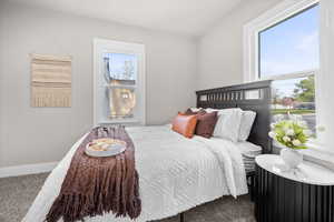 Bedroom with baseboards and carpet flooring