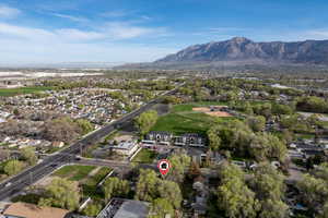 Aerial perspective of suburban area featuring a mountainous background