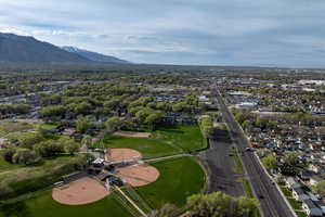 Aerial perspective of suburban area featuring a mountainous background