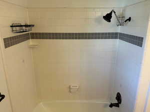 Bathroom featuring shower / washtub combination