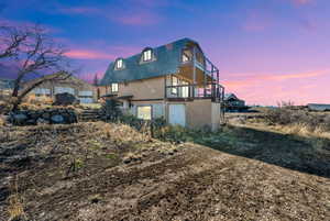Rear view of house with roof with shingles