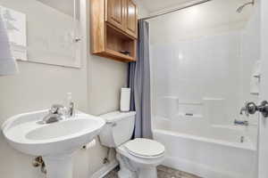 Bathroom with toilet and shower / tub combo