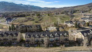 Aerial perspective of suburban area featuring a mountain backdrop