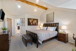 Bedroom with vaulted ceiling with beams, light carpet, recessed lighting, and connected bathroom