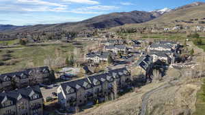 View of mountain backdrop featuring nearby suburban area