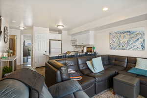 Living room with dark wood-style flooring