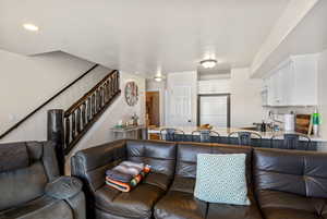 Living room featuring stairway