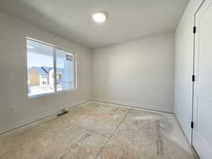 Unfurnished room featuring baseboards