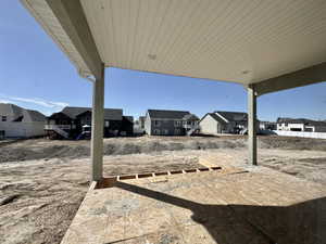 View of yard featuring a patio area and a residential view