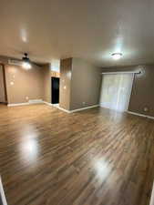 Unfurnished room featuring wood finished floors and ceiling fan
