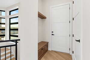 Mudroom featuring light wood-style floors