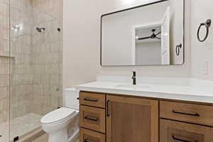 Full bath featuring vanity and a shower stall