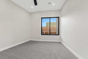 Empty room featuring light carpet, recessed lighting, and a ceiling fan