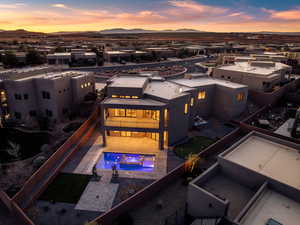 Aerial view at dusk of view of pool and a mountain view