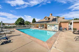 Community pool with a patio area