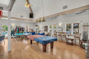 Game room featuring a ceiling fan and lofted ceiling
