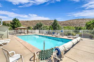 Community pool featuring a patio, a gazebo, and a mountain view