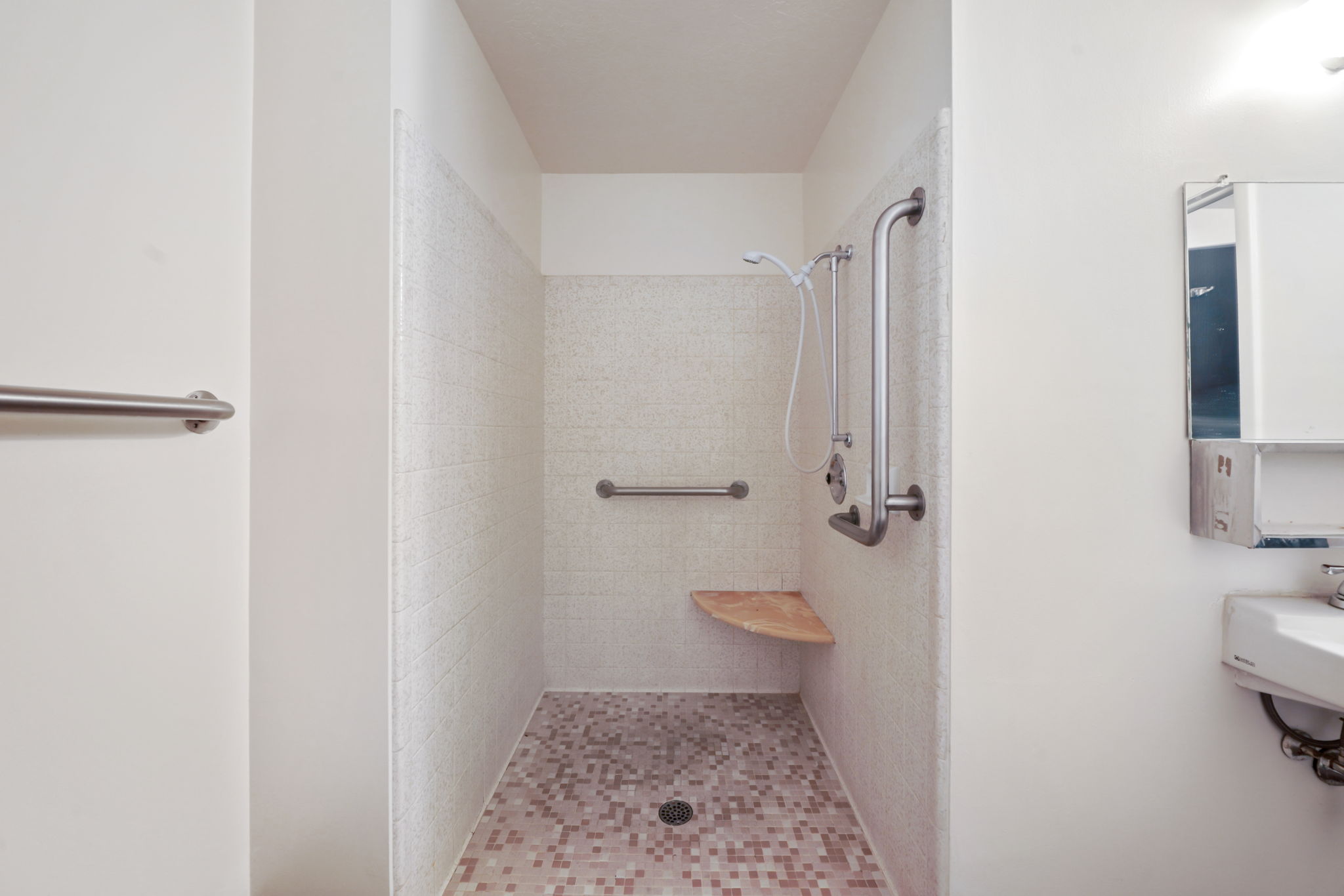 Full bath featuring a shower stall