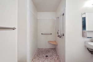 Full bath featuring a shower stall