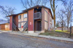 View of apartment building / complex featuring stairs