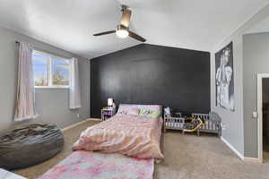 Bedroom featuring ceiling fan and light colored carpet