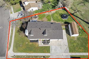 Aerial view of property and surrounding area featuring property parcel outlined