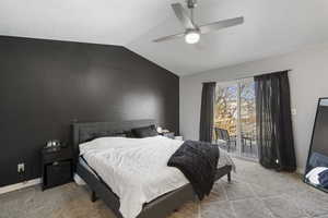 Bedroom with light colored carpet, access to exterior, lofted ceiling, and a ceiling fan