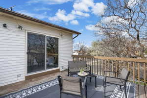 Wooden terrace featuring an outdoor living space