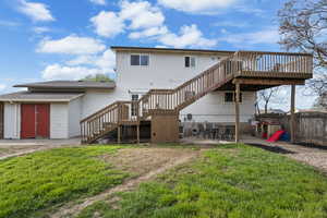Back of house featuring a patio and a wooden deck