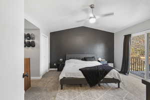 Carpeted bedroom with access to outside, a ceiling fan, and a textured ceiling