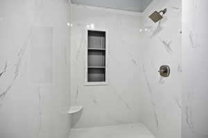 Full bathroom featuring a marble finish shower