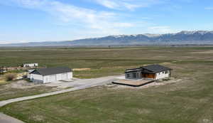 Overview of rural landscape featuring a mountain backdrop