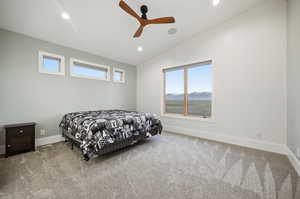 Owner's bedroom featuring vaulted ceiling, a mountain view, carpet, ceiling fan, and recessed lighting