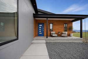 Virtually staged front entry covered porch