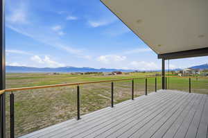 Deck featuring a mountain view and a view of countryside