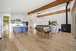 Living Room area featuring hardwood flooring, Vermont Castings wood stove, and recessed lighting