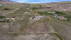 Aerial overview of property's location featuring rural landscape and a mountain backdrop