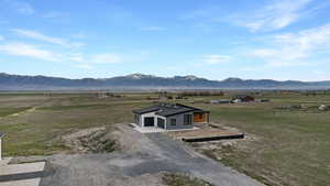 View of mountain backdrop with rural landscape