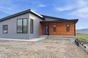 Modern home featuring covered porch