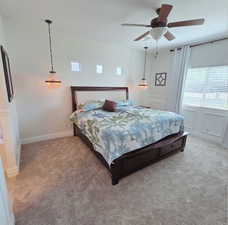 Bedroom featuring a ceiling fan and light carpet