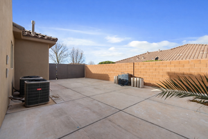 Fenced backyard with a patio area