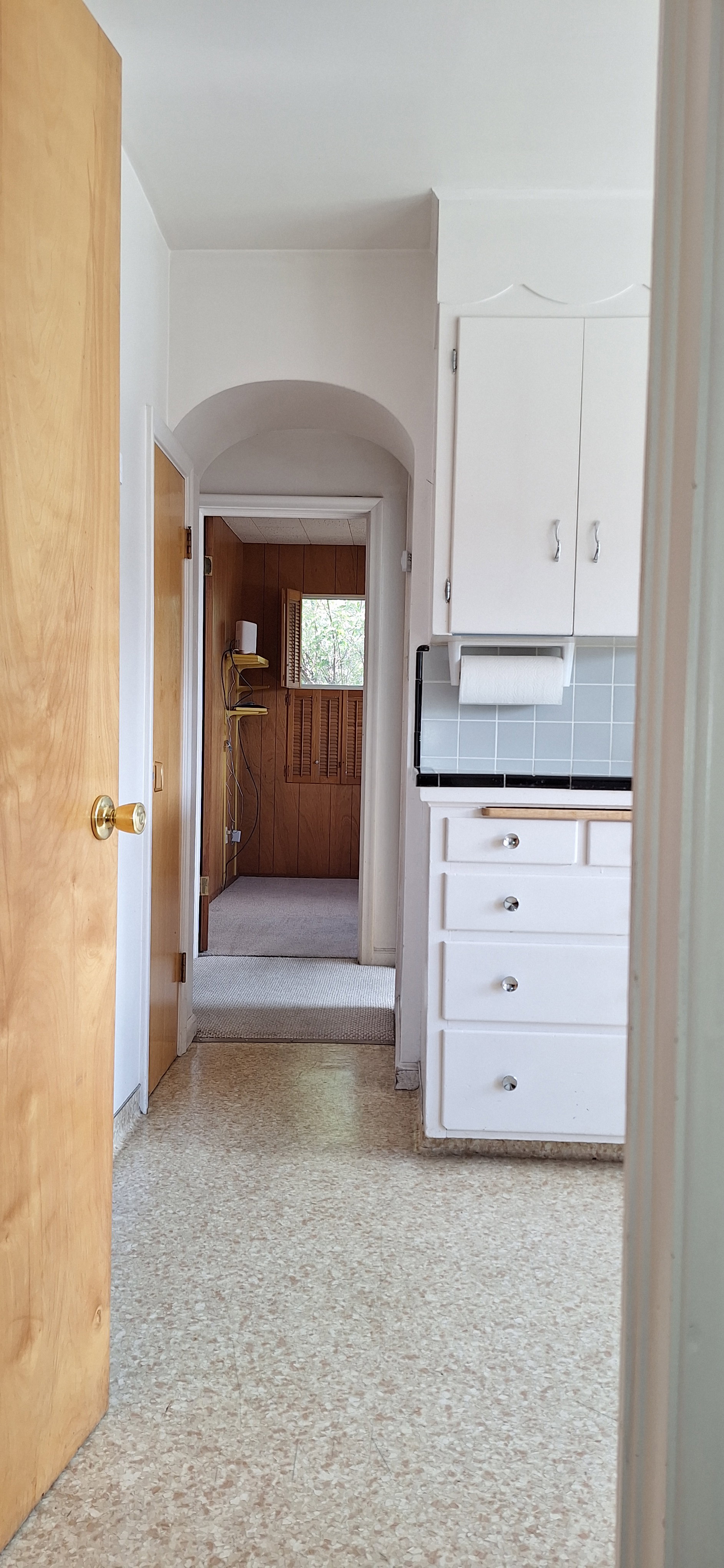 View through kitchen to second bedroom