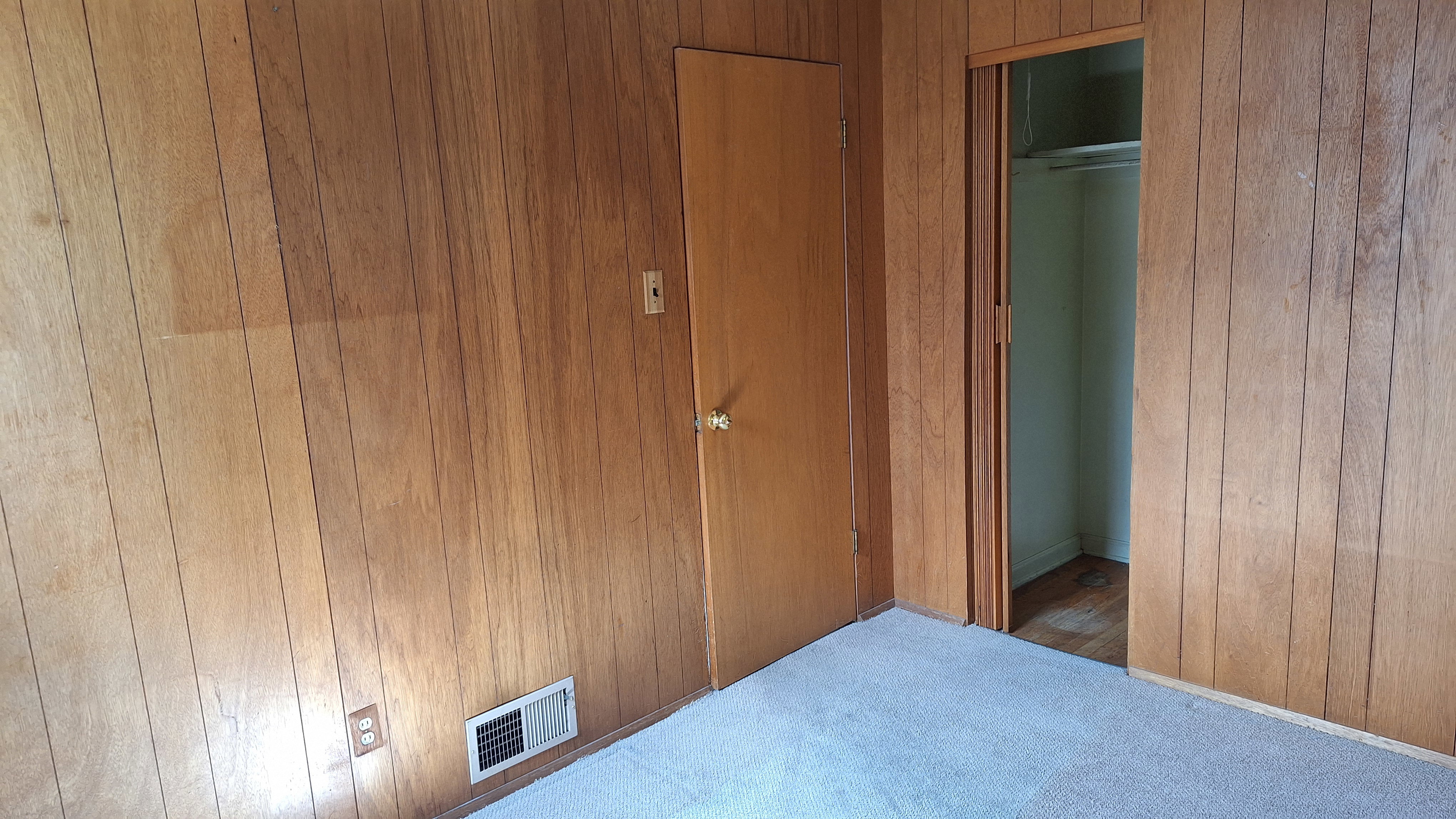 Southeast bedroom entry door and closet